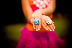 Girl with cocktail ring in her finger