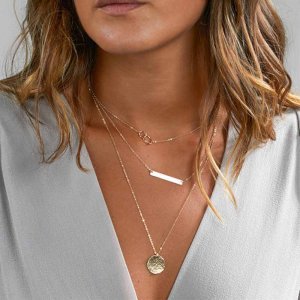 Layered necklace on a woman