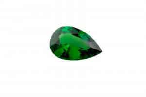 an isolated green tsavorite garnet gem stone