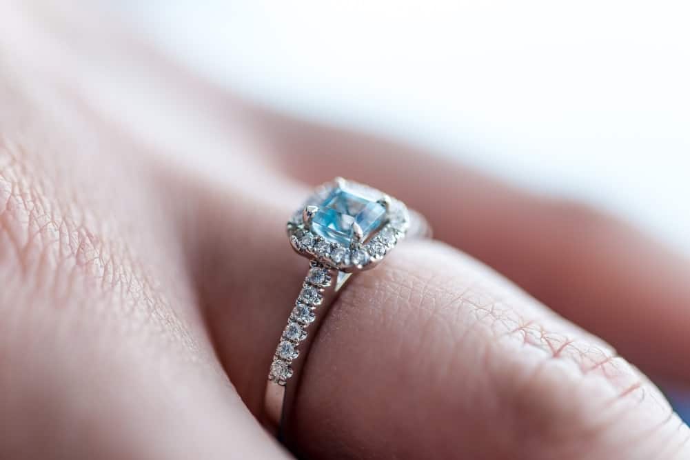 Blue zircon ring on woman finger
