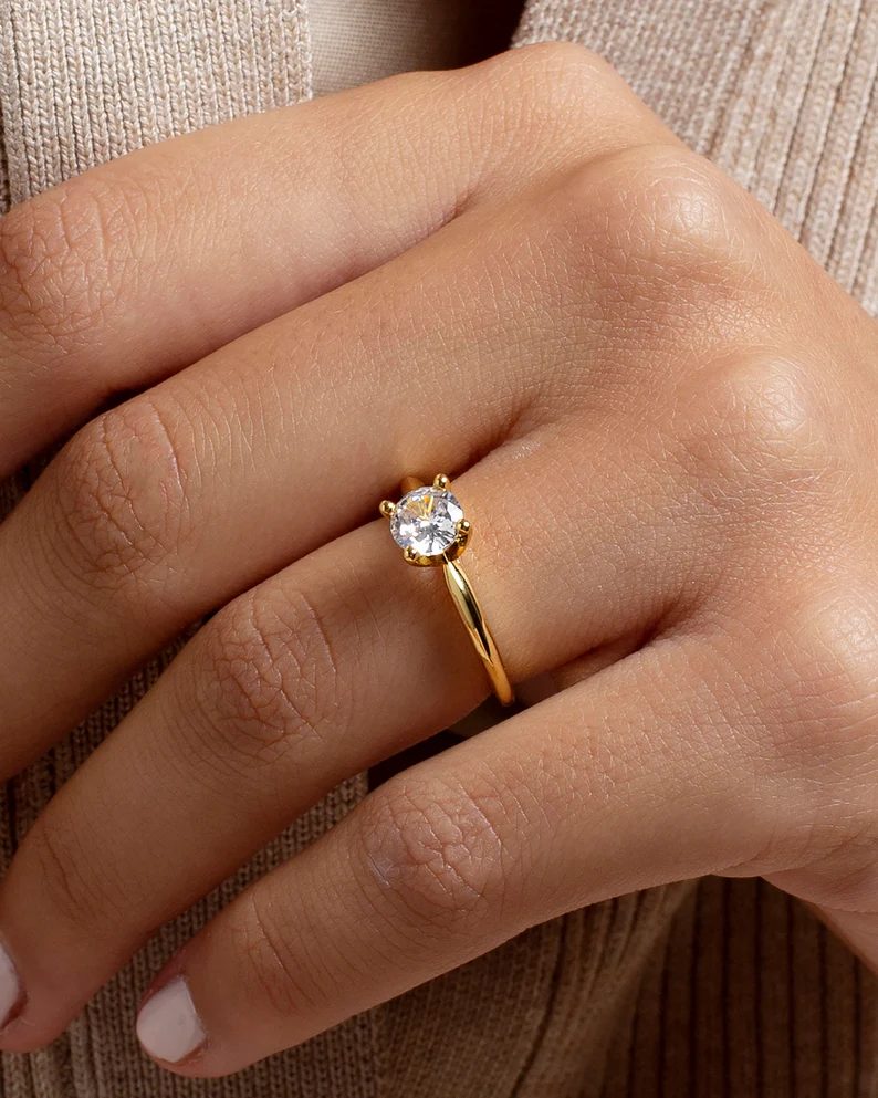 Dainty engagement ring with a prong round cubic zirconia stone