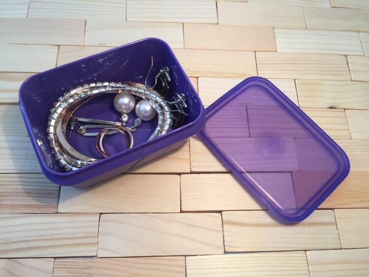 jewelry in snack container for traveling with jewelry