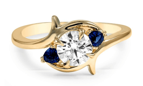 Blue sapphire and white diamond three stone engagement ring