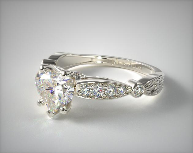vintage inspired engagement ring with heart shape diamond