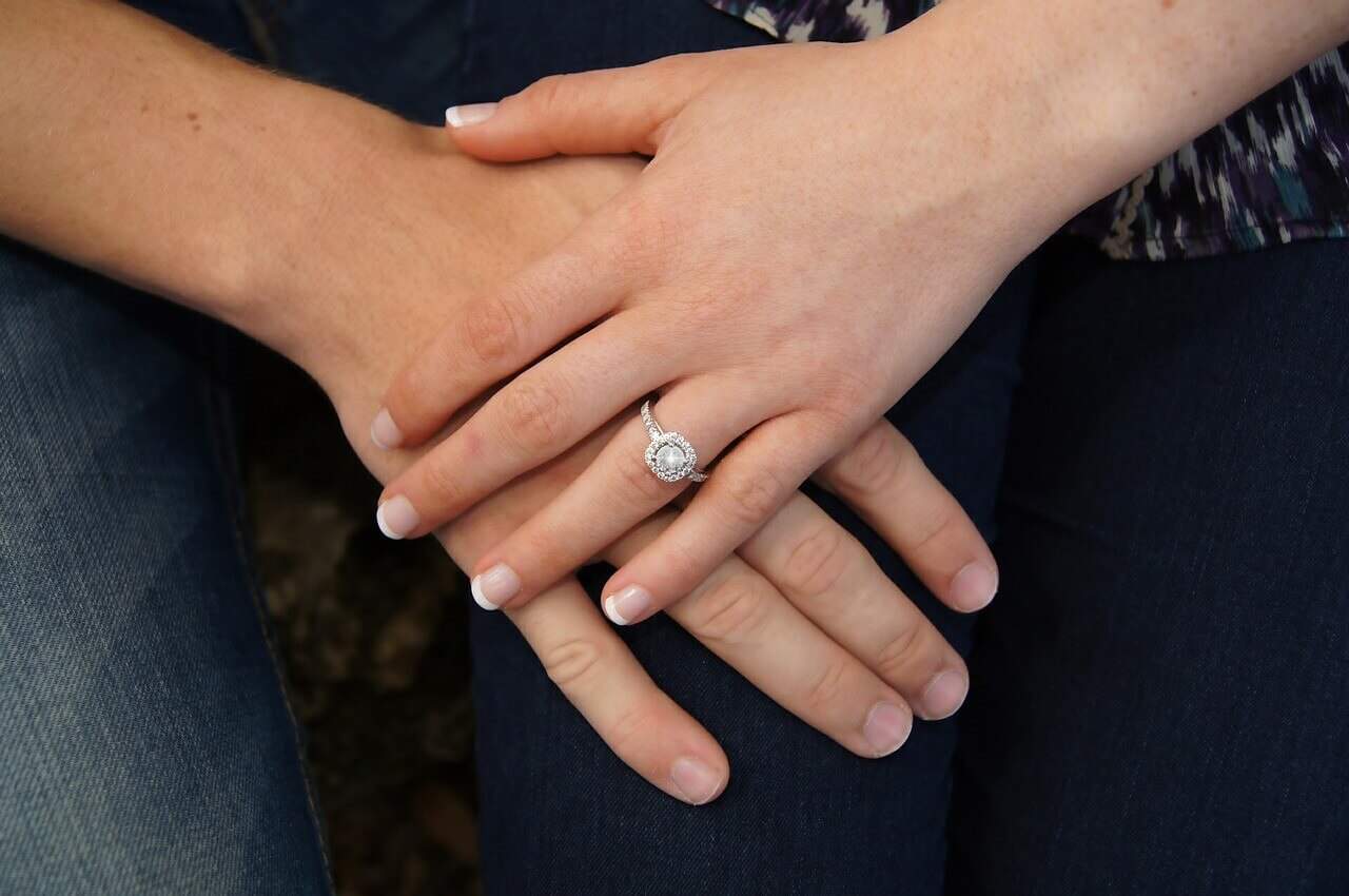 engagement ring on girls's finger