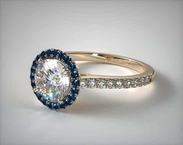 Blue sapphire and diamond engagement ring in halo setting
