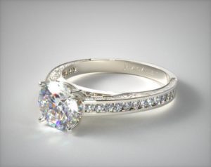 Round diamond in channel setting engagement ring