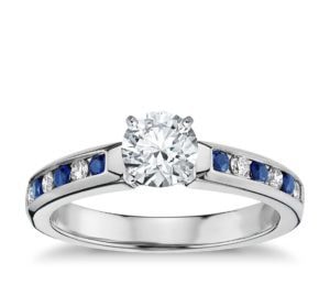 channel setting engagement ring with blue sapphire