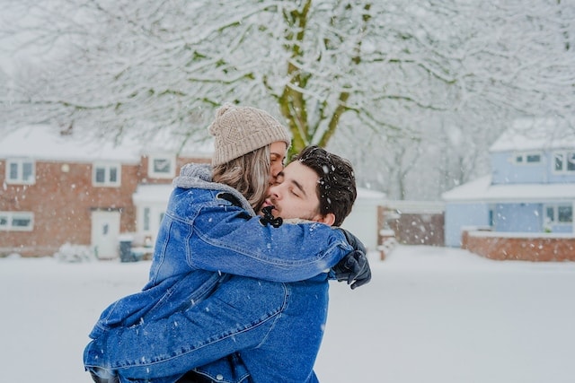 couple playing in snow