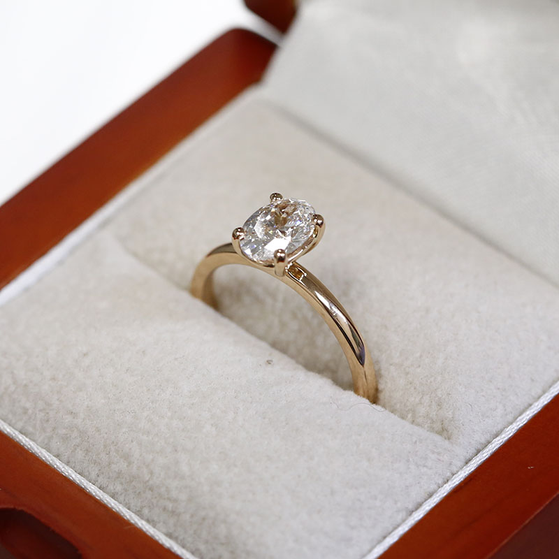 Four Claw Oval Cut Diamond Engagement Ring