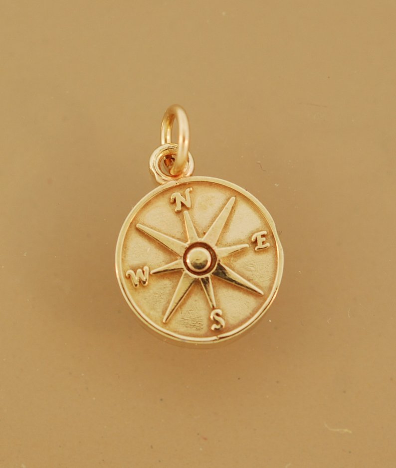 Golden compass charm as graduation jewelry gift