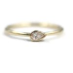 horizontal pear shaped diamond engagement ring