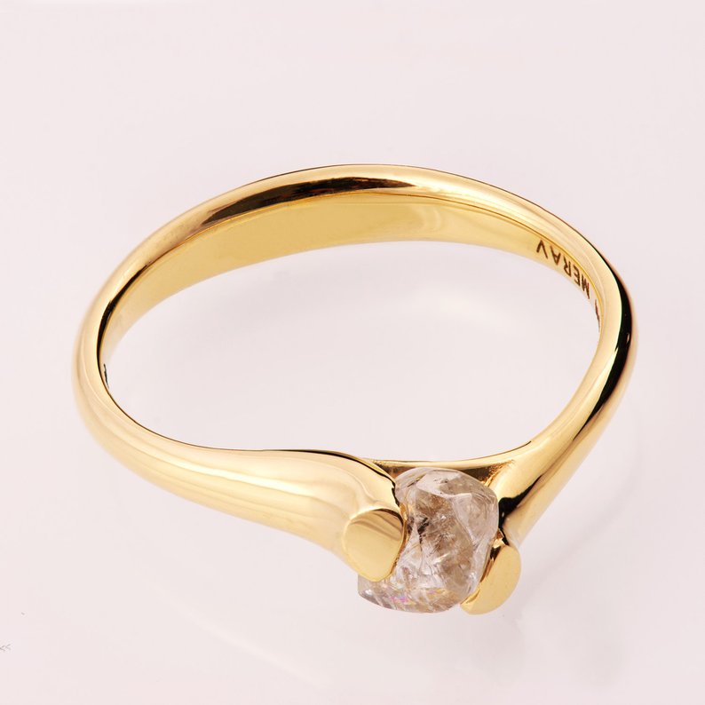 Raw diamond engagement ring in yellow gold
