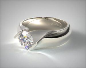 tension set engagement ring with round shape diamond