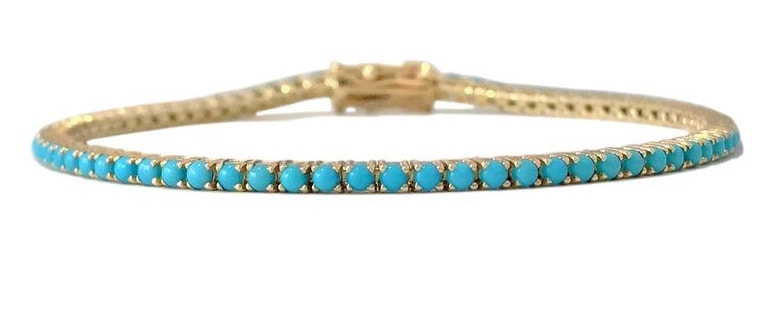 Turquoise tennis bracelet in yellow gold
