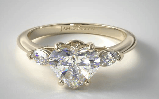 Heart shaped marquise side three stone engagement ring