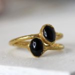 Black obsidian rings in gold