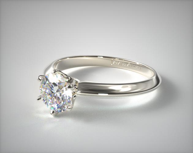 Platinum engagement ring with round shape diamond prong setting