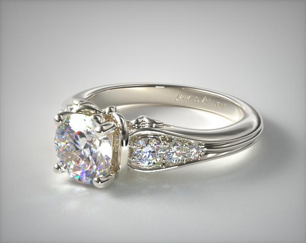 Platinum engagement ring with side stones