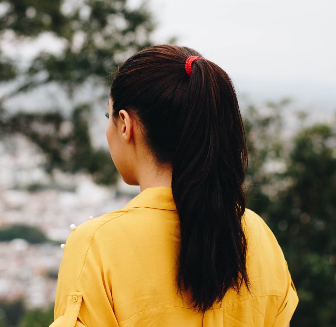 Girl with ponytail hair style wearing yellow dress