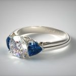 trillion cut sapphires and round diamond ring