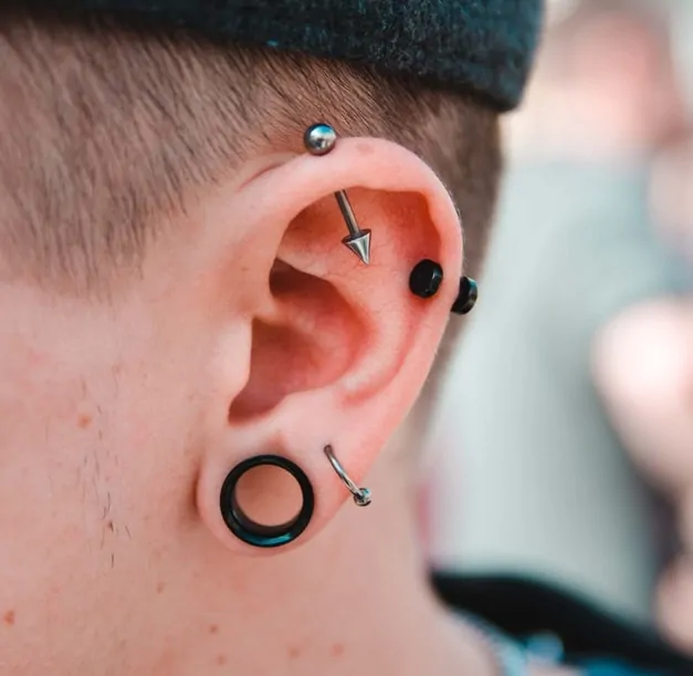 Plug earring on ear close up