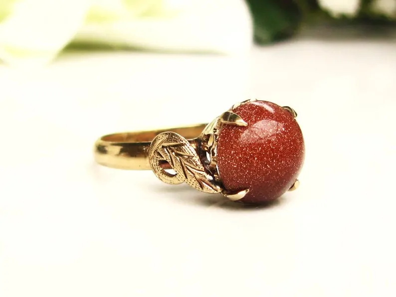 Red goldstone ring