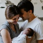 Couple with new born baby, dad thinking of giving push gift