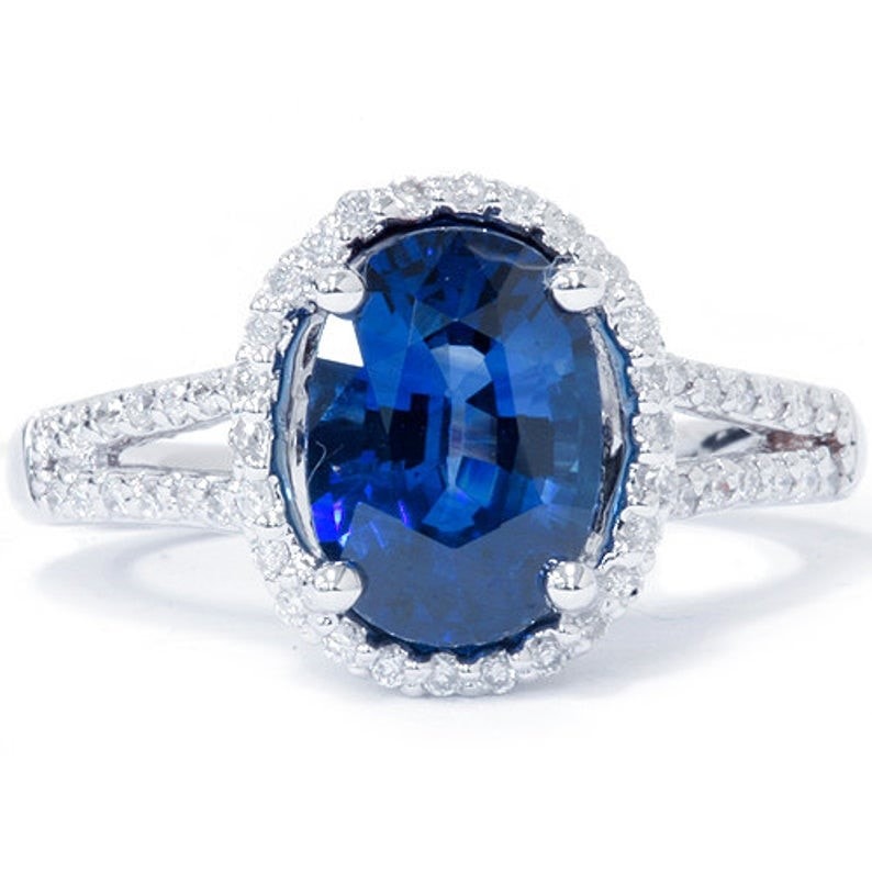 Blue sapphire and diamond engagement ring in white gold