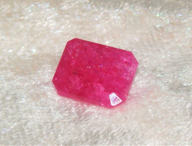 Red bixbite gemstone close up