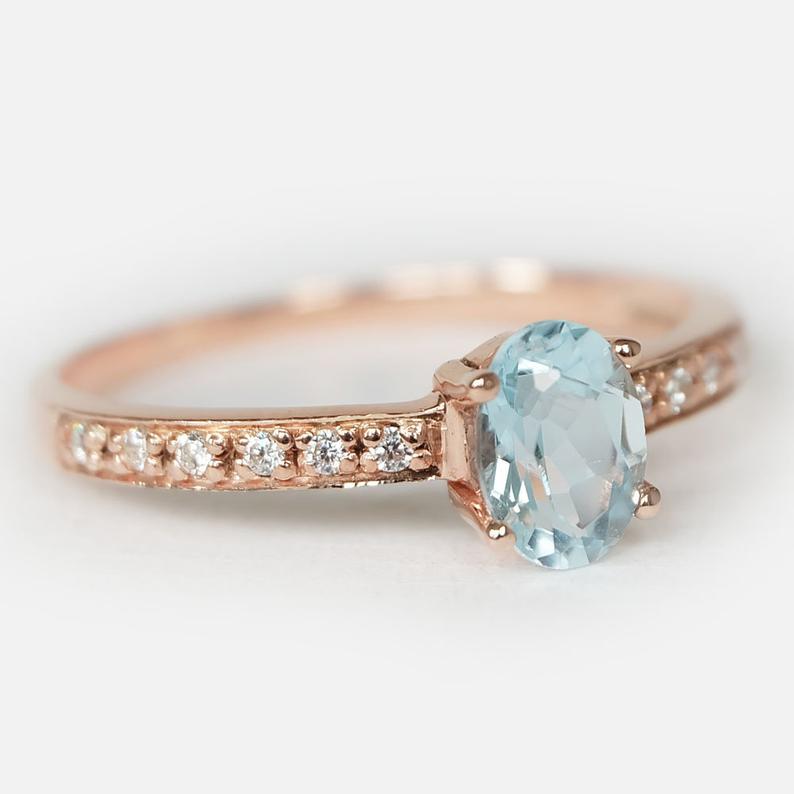 Faceted aquamarine ring in rose gold setting
