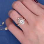 Ring guard with pear-shaped solitaire engagement ring