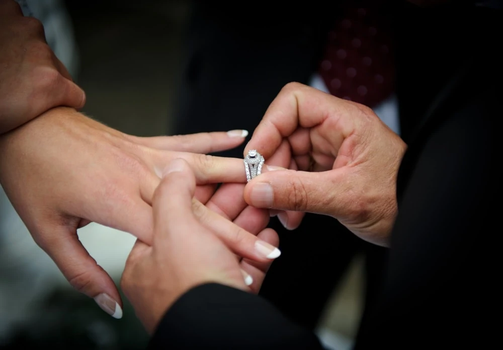 Girl wearing ring guard for her engagement ring