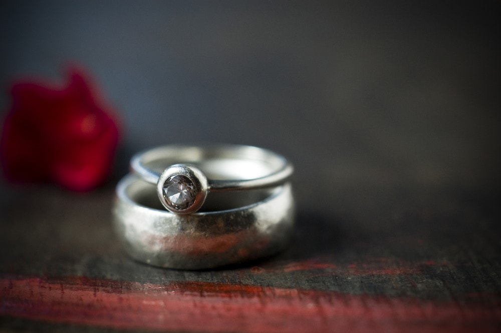 Wedding and engagement ring on top of each other
