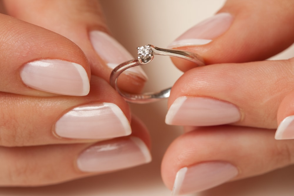 Woman choosing engagement ring width