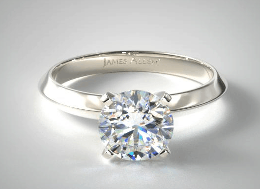 Knife edge engagement ring with round shape diamond