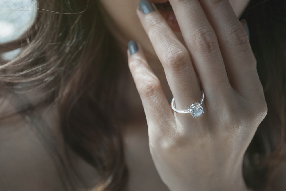 Bride wearing low profile engagement rings