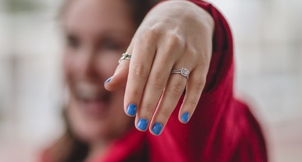 Girl showing her pave setting engagement ring