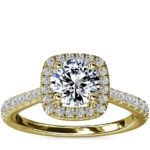 Tapered halo band engagement ring