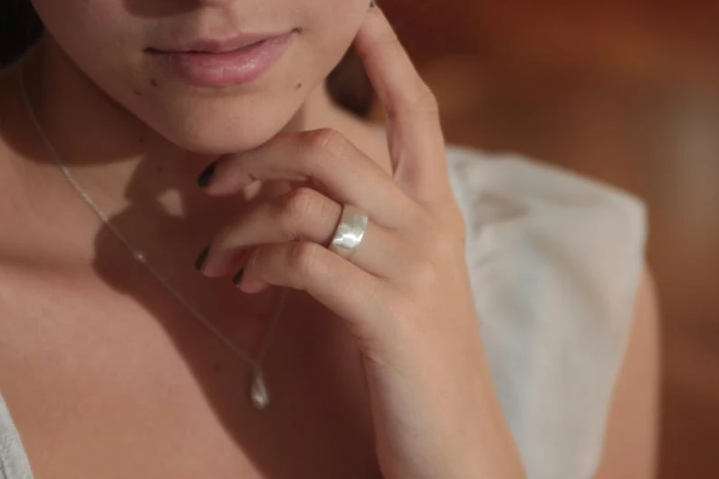 Girl wearing thick wedding band