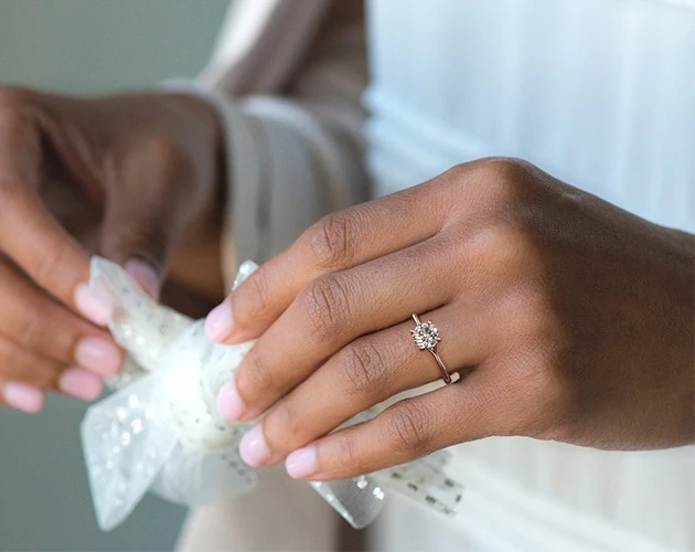 Bride wearing thin engagement ring band