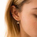 Girl with multiple cartilage piercings
