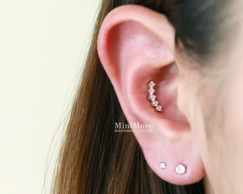 Girl wearing inner conch piercing stud