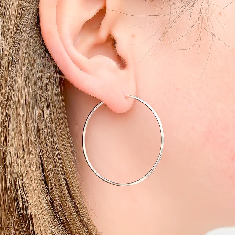 Hoop earrings on girl's ear