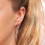 Girl wearing minimalist cartilage earrings