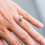 Princess cut diamond engagement ring on girl's finger