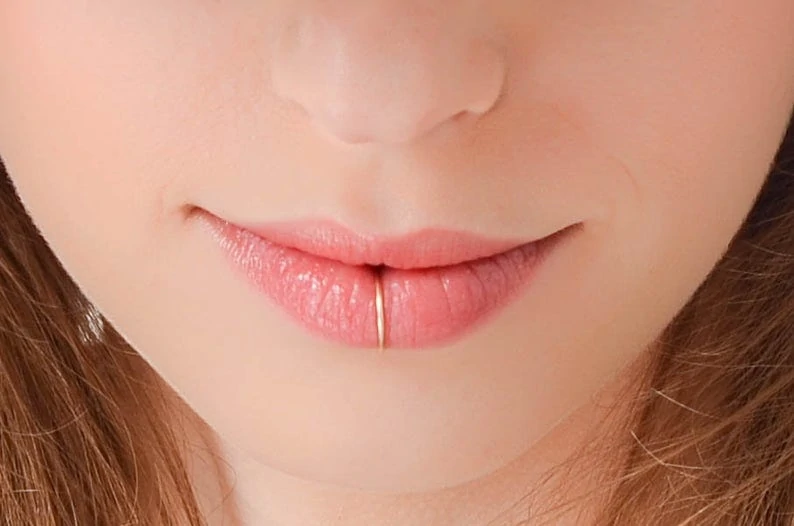 Girl with seamless lip ring