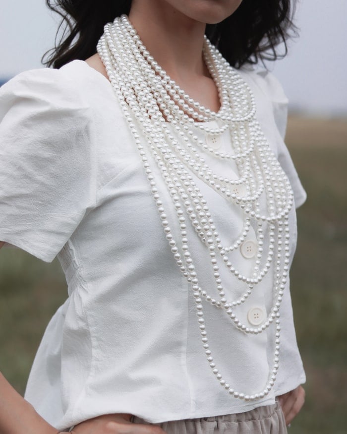 Girl wearing pearl necklace