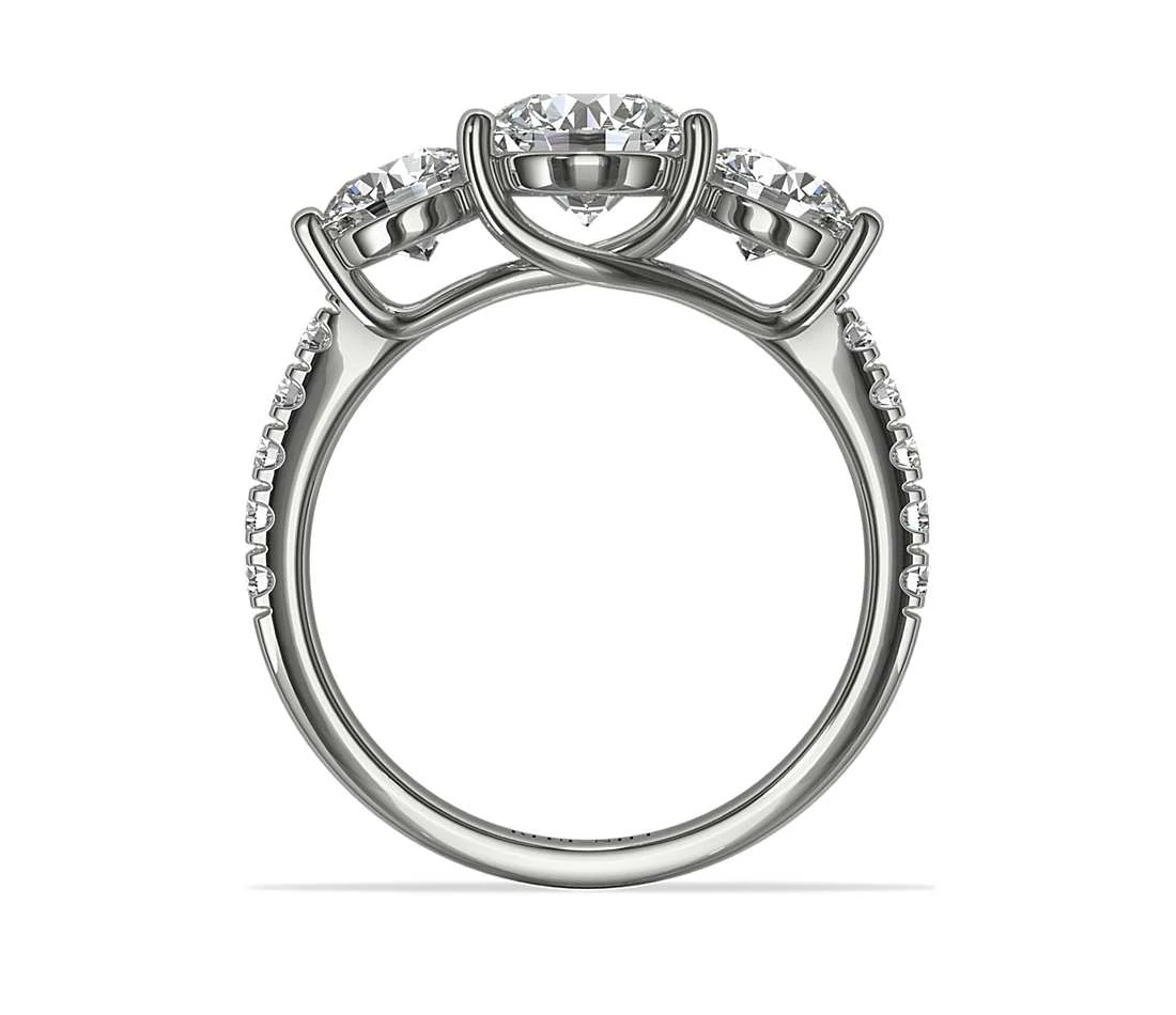 Three stone trellis setting engagement ring