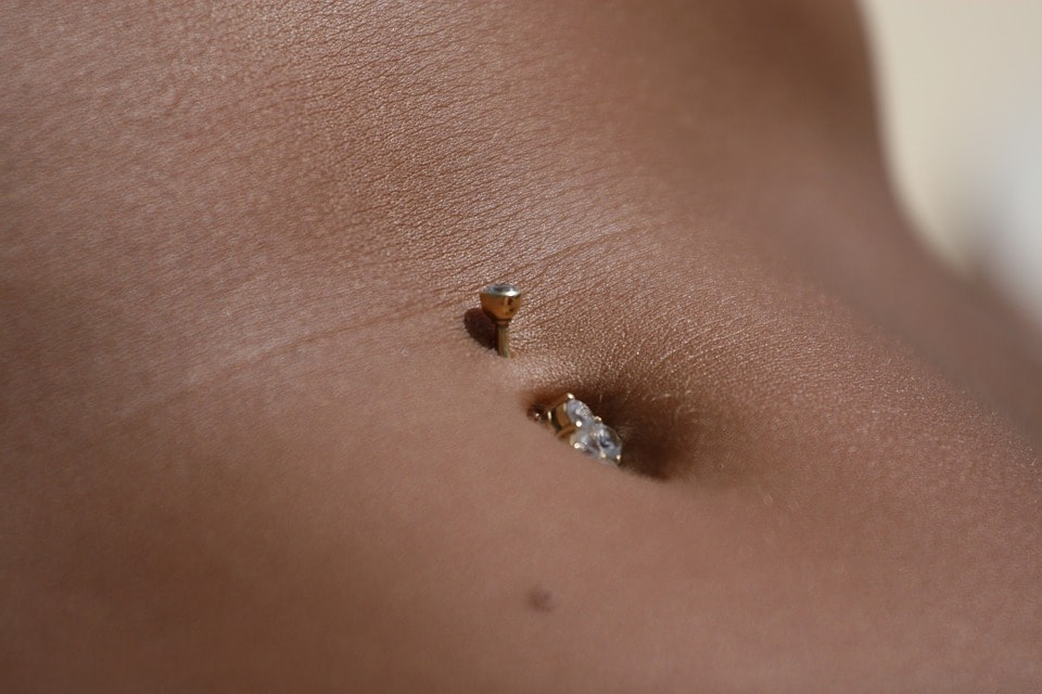 Belly button piercing close up